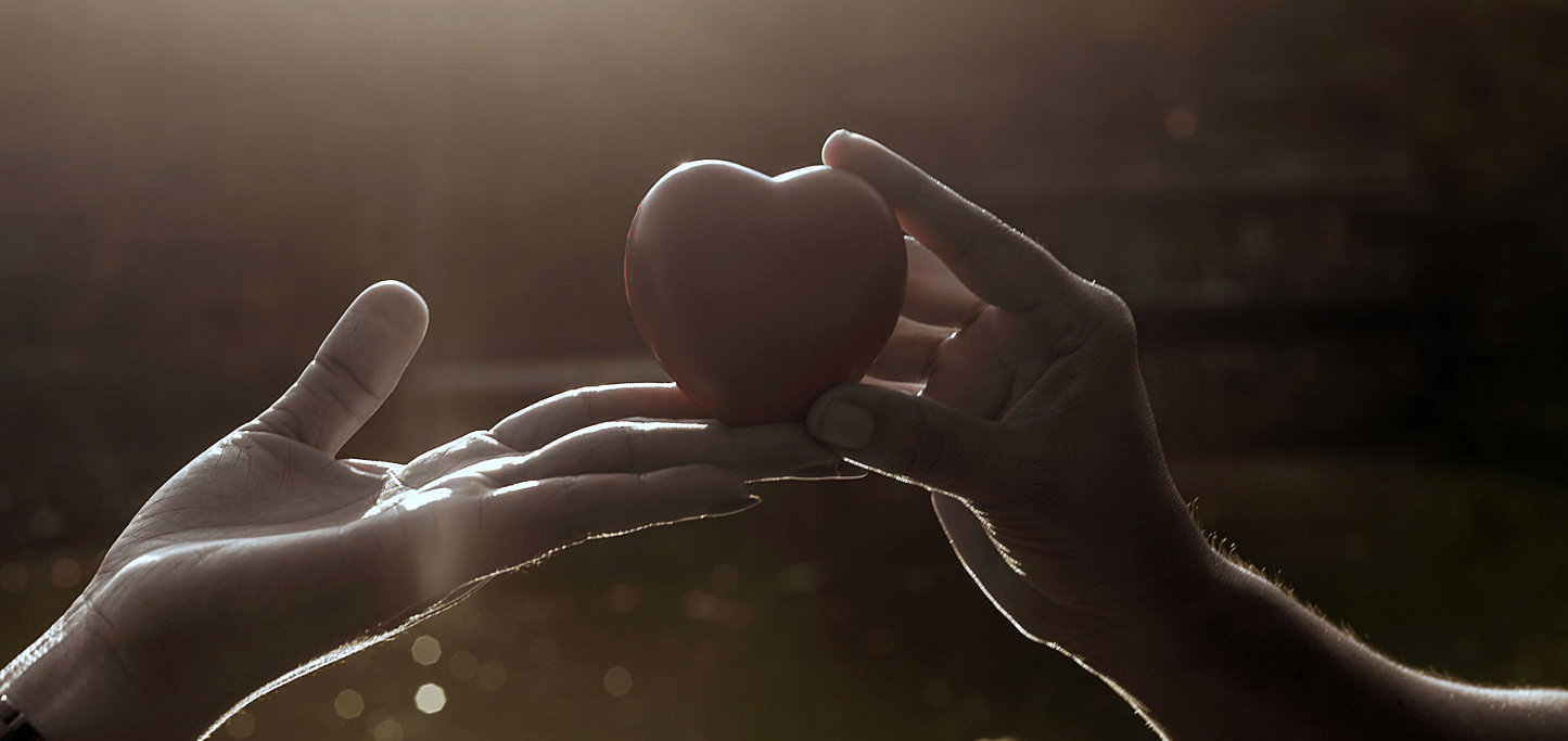 hand holding a heart figure
